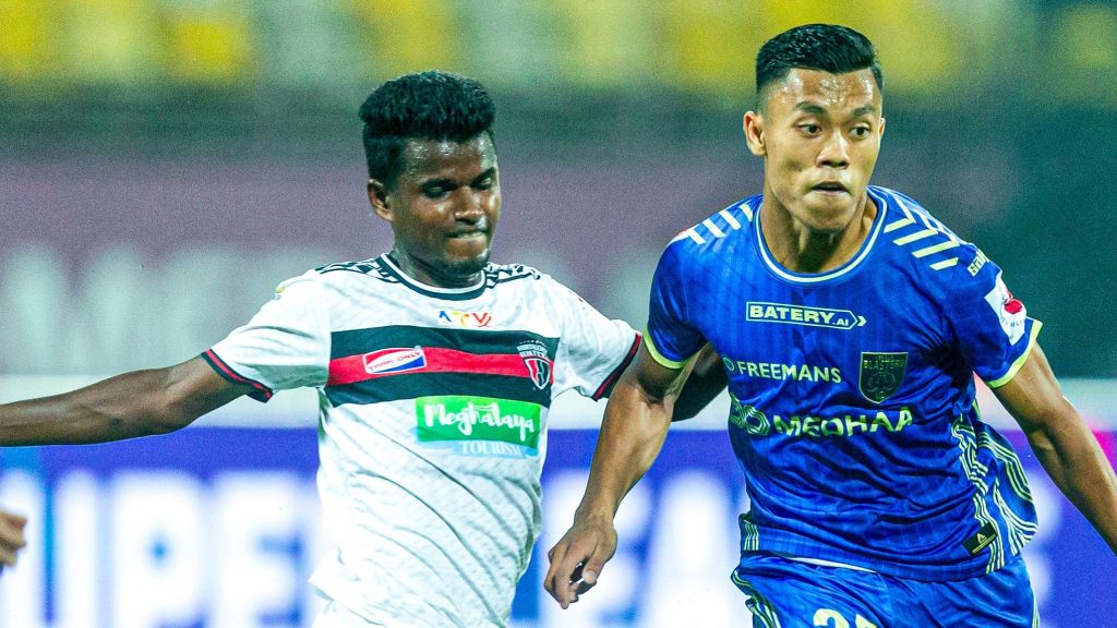 Northeast United midfielder Bekey Oram and Kerala Blasters defender Korou Singh in action. 