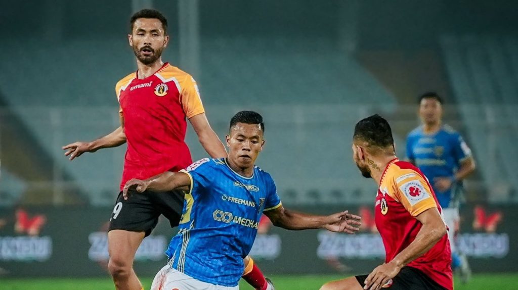 Korou Singh in action against former Kerala Blasters players Nishu Kumar and Mahesh Singh