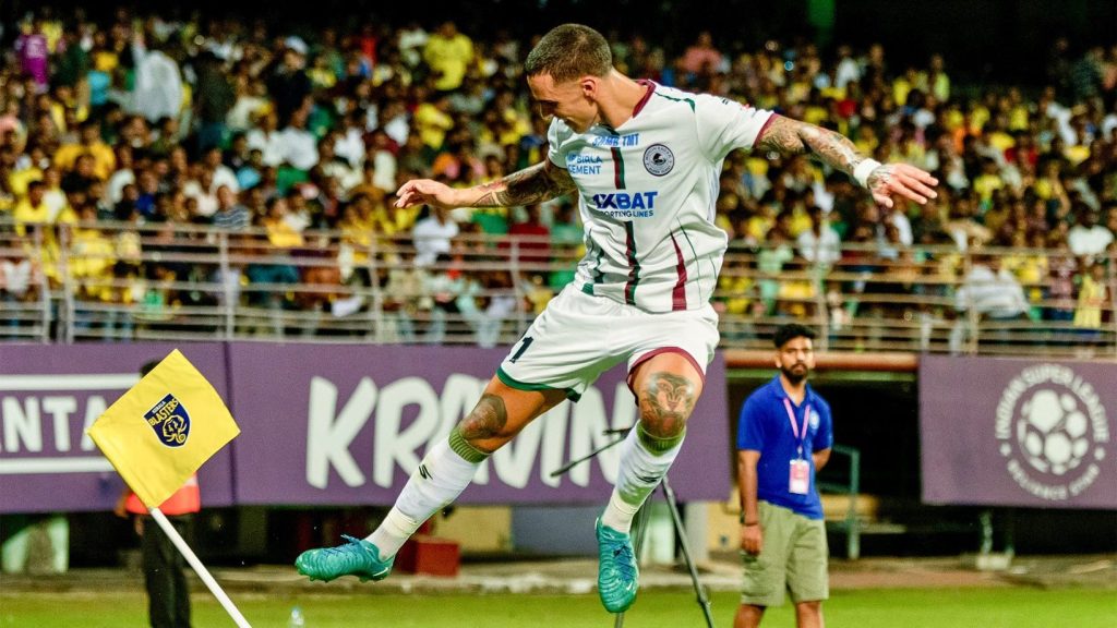 Alberto Rodriguez kicking off the Kerala Blasters flag to celebrate the victory.