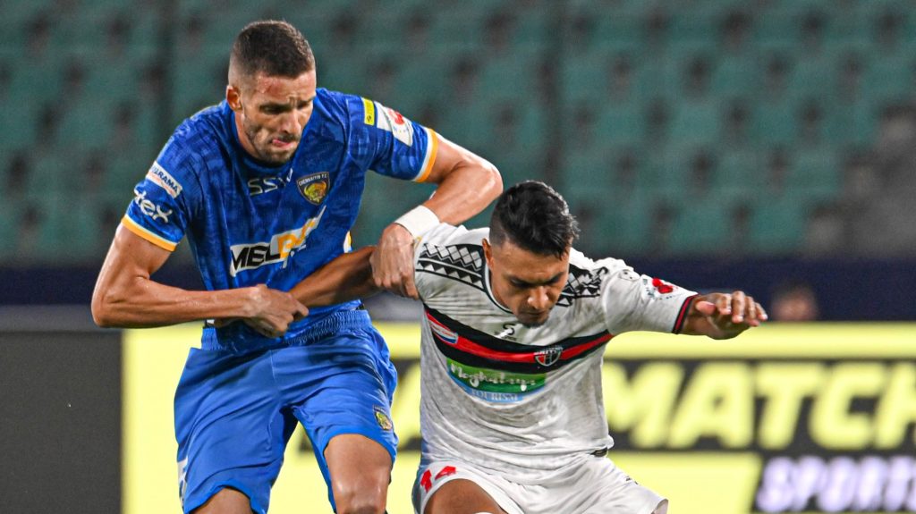 Chennaiyin FC defender Elsinho in action against Northeast United striker Alaeddine Ajaraie