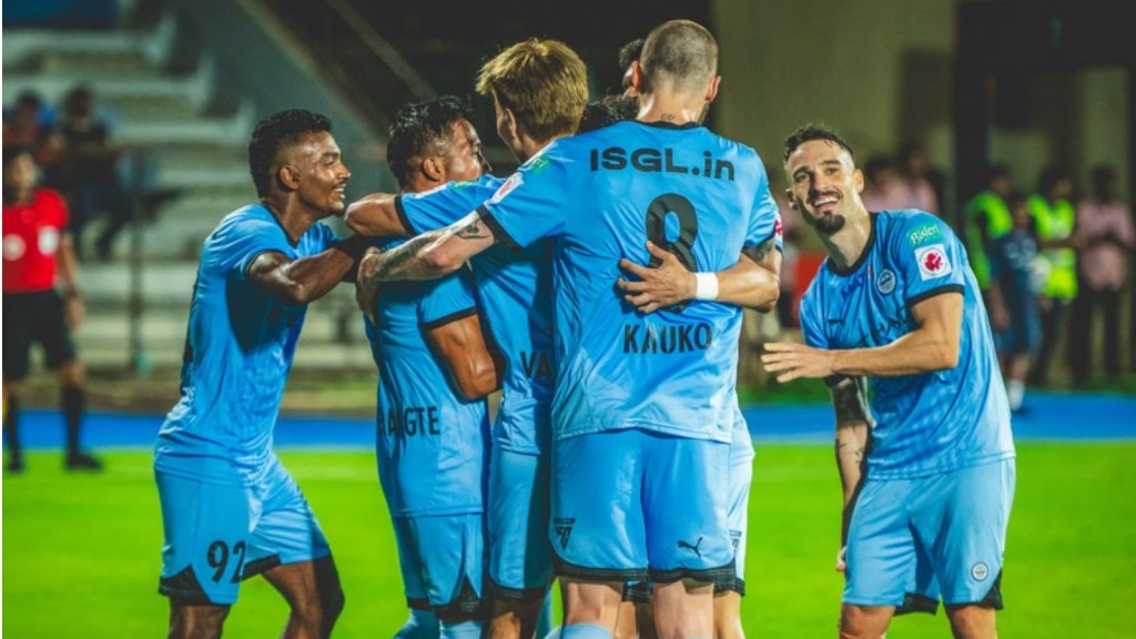 Mumbai City players celebrate scoring against Odisha FC.